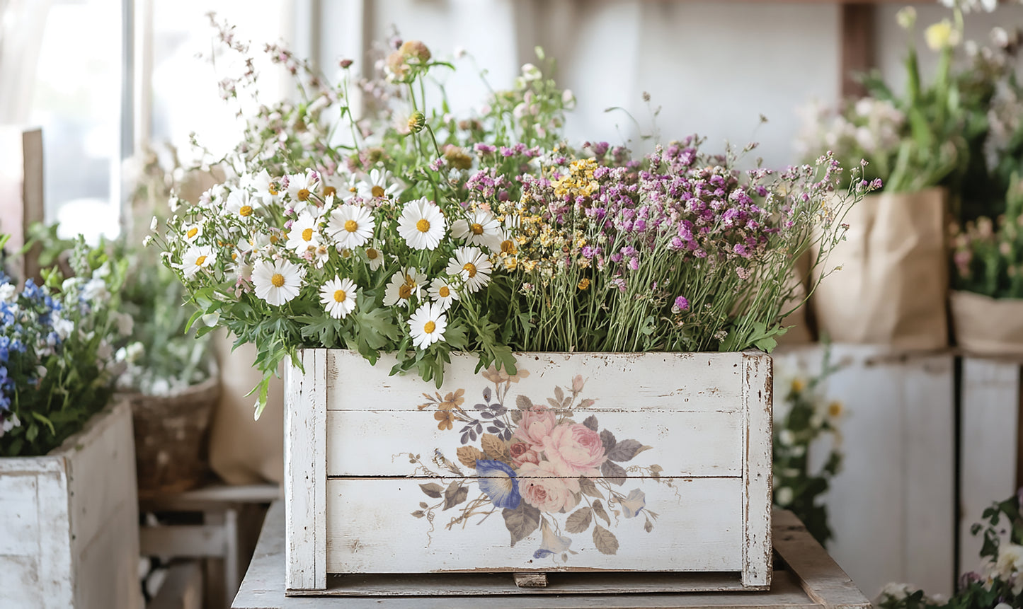Decorative wooden planter with flowers on a table by Iron Orchid Designs