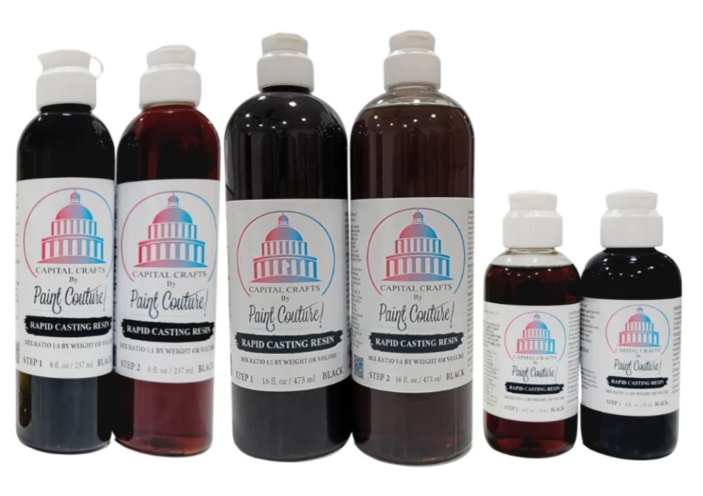 Six bottles of Capital Crafts Paint Couture Rapid Casting Resin in various dark amber and black shades, arranged in two rows against a plain white background.