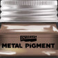 Jar of Pentart Fire Gold metal pigment with a silver lid on a black background