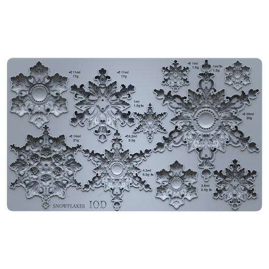 Grey silicone mould showing 10 different snowflakes. On a white backgorund. Snowflakes by Iron Orchid Designs