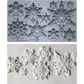 A 10D snowflake craft mold sheet shown in two views: the top shows the gray plastic mold with labeled snowflake cavities, and the bottom shows several white embossed snowflake decorations pressed into the mold. Snowflakes by Iron Orchid Designs