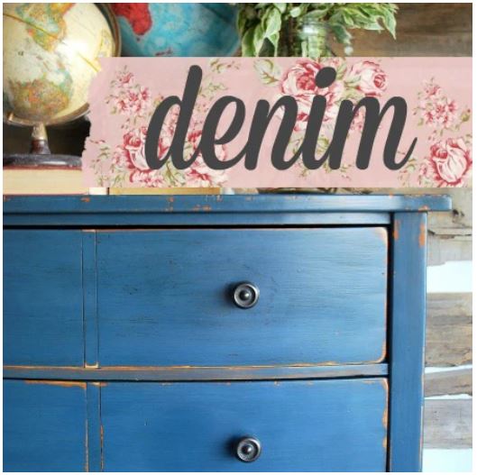 Blue dresser with a pink decorative sign that says 'denim' on top.