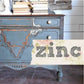 Decorative furniture piece with 'zinc' text overlay