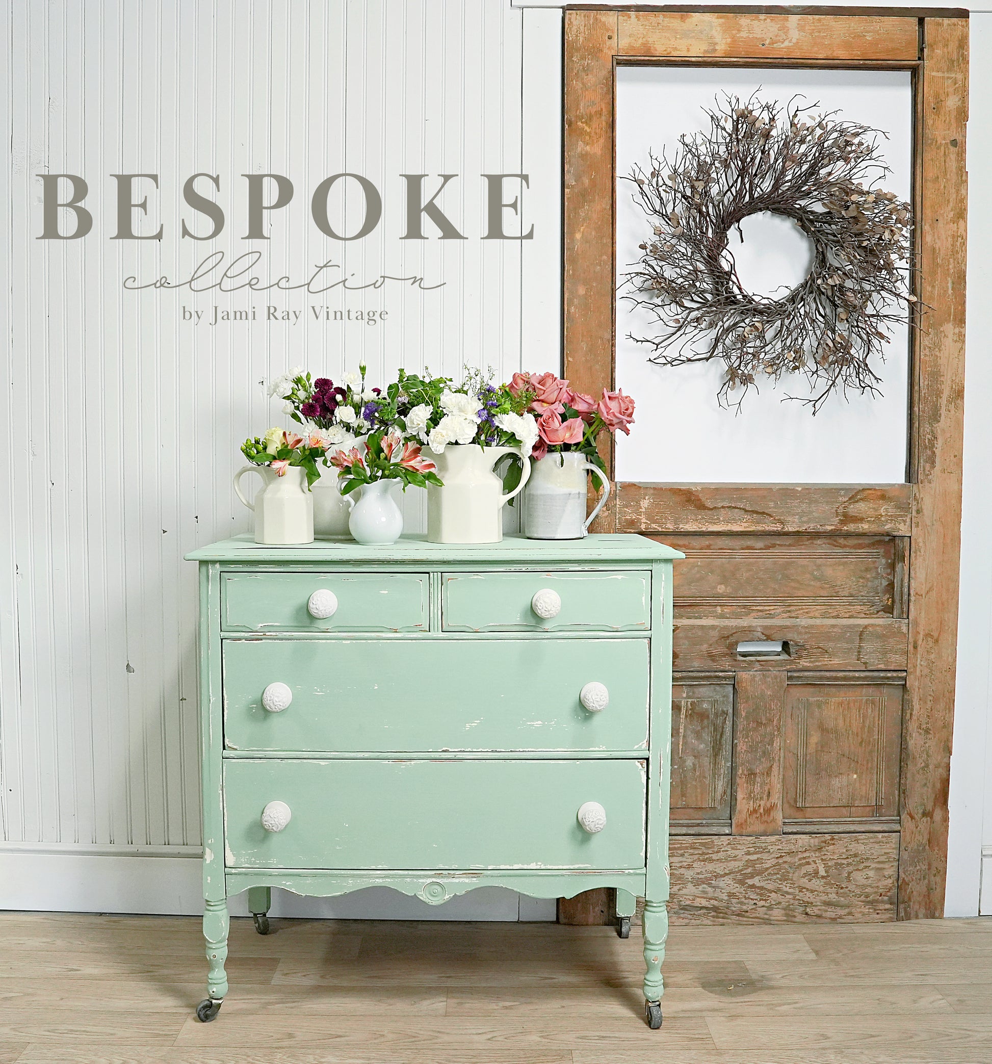 Vintage-style dresser with flowers in a rustic interior setting, featuring the 'Bespoke Collection' by Jami Ray Vintage.
