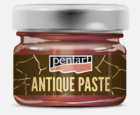 A jar of Pentart Copper Antique Paste, featuring a dark brown label with gold crackle details and a metallic silver lid, set against a plain light gray background.