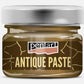 A jar of Pentart Antique Paste, featuring a metallic silver lid and a dark brown label with gold crackle details and cream lettering, set against a plain white background. Antique Gold Paste.