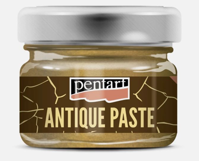A glass jar of Pentart Brass Antique Paste with a metallic silver lid and a dark brown label featuring gold cracks and cream lettering, set against a plain white background.