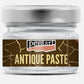 A small clear glass jar of Pentart White Antique Paste with a brushed silver metal lid and a brown label featuring gold crackle details and the brand name 'pentart'.
