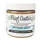 A jar of Paint Couture Antique Gold metallic paint with a white lid and a white label featuring green leaf illustrations and black text.