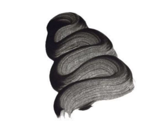 A textured, swirl of Paint Couture Black Chiffon Antiquing Glaze on a plain white background.