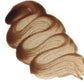 A textured swatch of warm medium color, Brown Sugar Antiquing Glaze by Paint Couture shown in a swirled, layered smear on a plain white background.