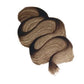 A swirled section of Paint Couture Antiquing Glaze in Van Dyke Brown, isolated on a plain white background.