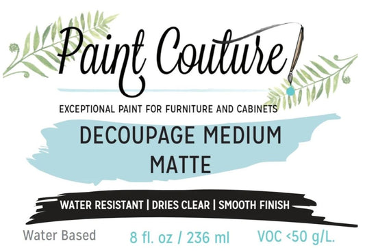 A product label for Paint Couture Decoupage Medium Matte paint. The label features a white background with green leaf illustrations, a paintbrush graphic, and a light blue paint brushstroke.