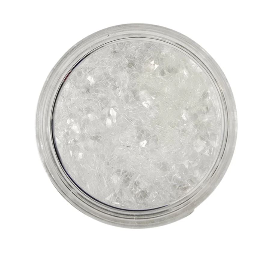 A pot of Snowflake Glitter flakes by Paint Couture.