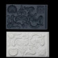 Iron Orchid Designs Classic Elements grey Mould above white castings of the mould