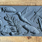 Iron Orchid Designs Dewdrop Pond grey Mould laying on a wooden surface. Highly detailed hummingbird, dragonfly, fern, frog, tortoise designs.