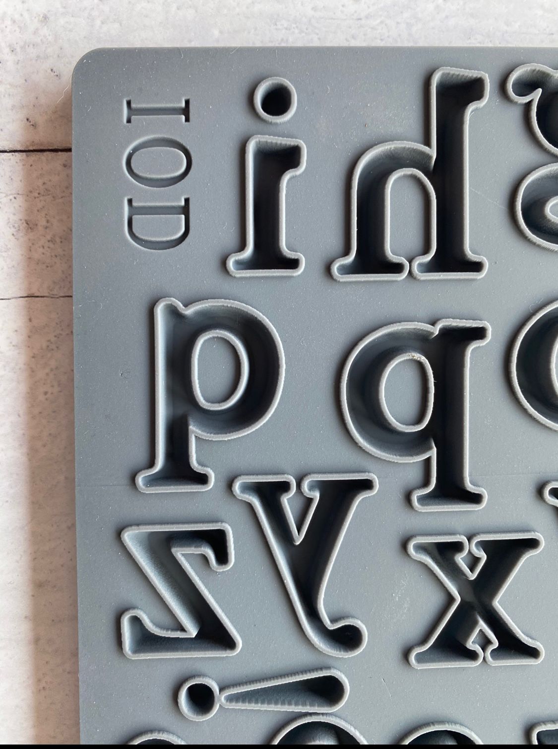 Iron Orchid Designs Harper grey silicone mould close up of individual letters in the mould