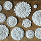 Iron Orchid Designs Rosettes Mould circular white decorative castings made out of clay
