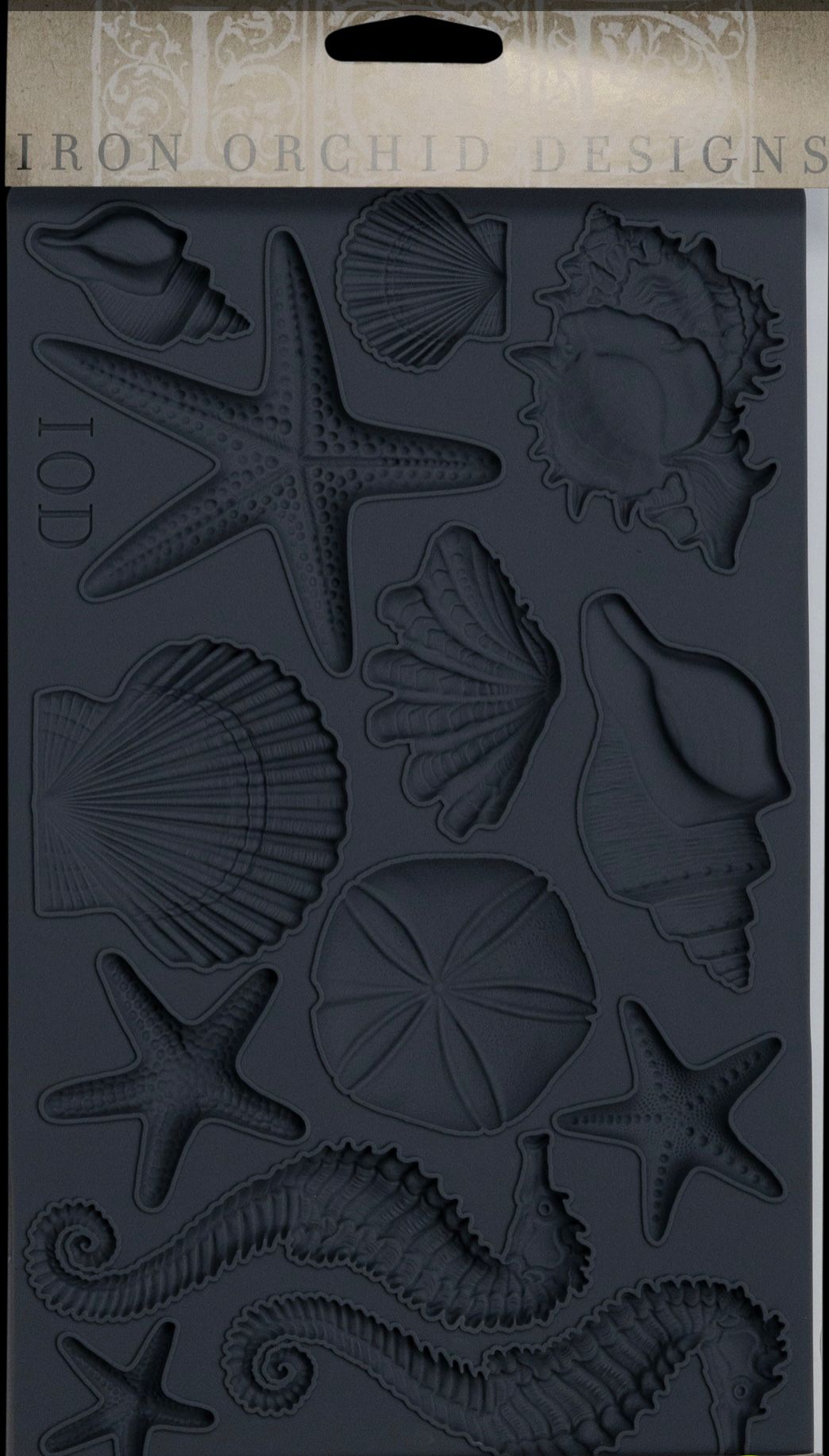 Iron Orchid Designs Seashells grey Mould front of packet showing intricate designs of shells, starfish and seahorse