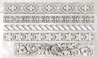 White clay castings from Iron Orchid Designs Trimmings Two decorative trims Mould on a white background