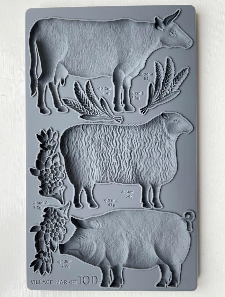 Iron Orchid Designs Village Market grey silicone mould with cow, sheep and pig on a white background
