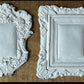 Iron Orchid Designs Frames 2 castings laying on a wooden surface