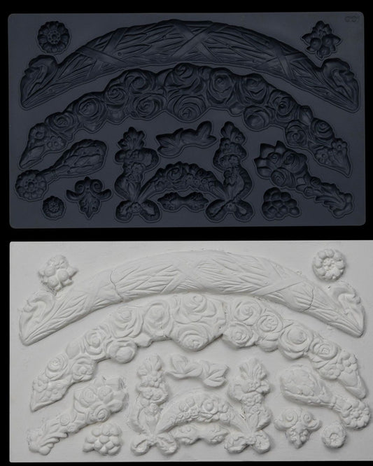 Iron Orchid Designs Swags grey Mould above white clay castings of the mould