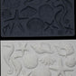 Iron Orchid Designs Seashells grey Mould above white clay castings of the mould