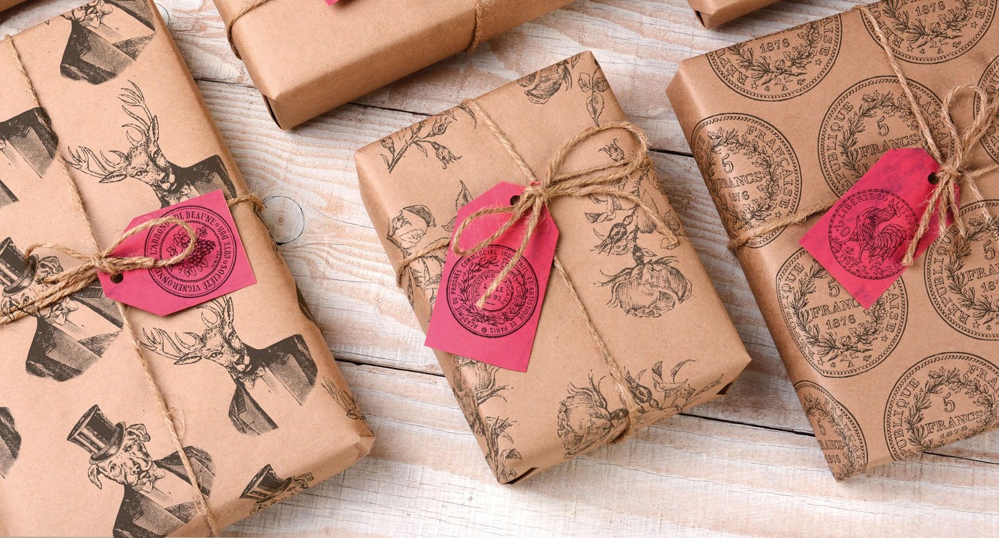 A collection of gifts wrapped with brown paper stamped using Iron Orchid Designs Antiquities stamps