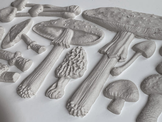 White clay castings from Iron Orchid Designs Toadstool grey Mould laying on a white surface