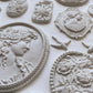 Iron Orchid Designs Cameos Mould white castings in close up.