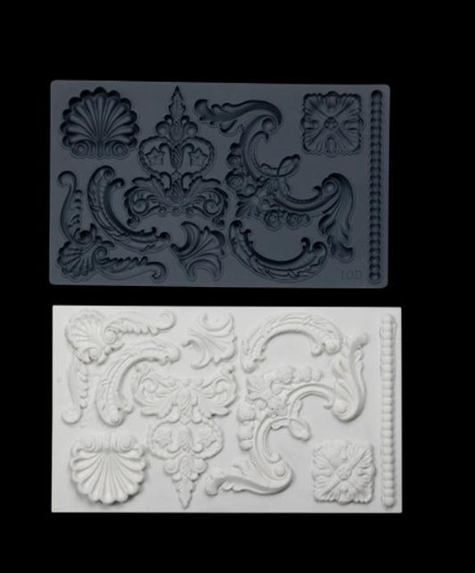 Iron Orchid Designs Classic Elements grey Mould above white castings of the mould