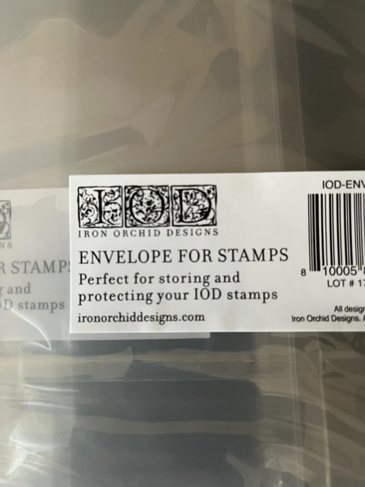 A close up picture of Iron Orchid Designs semi-transparent Stamp Envelopes on a dark surface