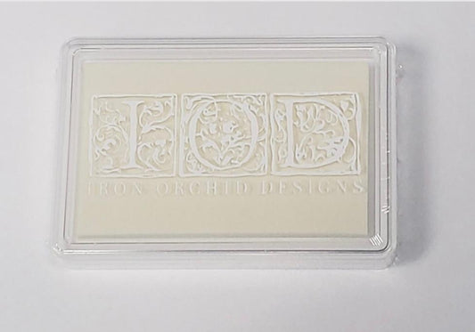 Iron Orchid Designs Ink pad with a light yellow foam pad and a clear plastic cover